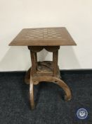 An Edwardian Arts and Crafts oak chess board top occasional table CONDITION REPORT: