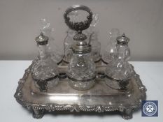 A Victorian silver plated cruet stand with seven piece cut glass cruet set