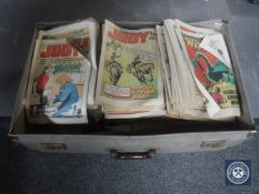 A vintage luggage case containing a large quantity of 1970's comics including Wizard, Judy,