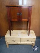 A pine two drawer unit together with a double door cupboard