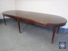 A reproduction oval boardroom table on six legs, length 337 cm.