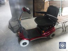 A Shop Rider Deluxe mobility cart with key and charger
