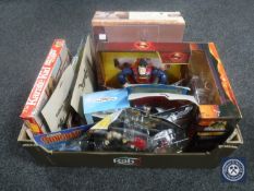 A box of assorted action figures and toys