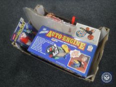 A box containing assorted toys including a boxed vintage engine, Captain Scarlet die cast figures,