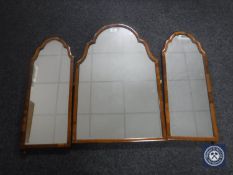 A triple walnut dressing table mirror