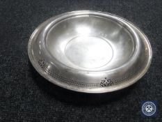 A white metal bowl with pierced rim, stamped Sterling, width 27.