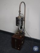 A mahogany cased volt meter converted into and industrial style lamp