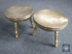 A pair of circular Eastern brass stools