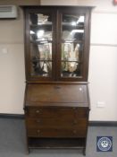 An Edwardian oak bureau bookcase