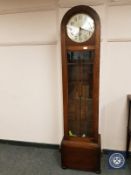 An oak regulator clock with silvered dial,