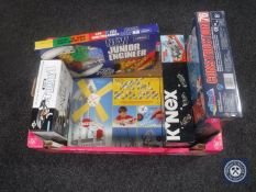 A box containing five boxed construction sets,