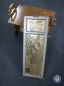 A two-tier walnut Arts & Crafts table together with an oriental hand painted panel depicting geisha
