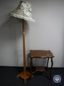 A mahogany Art Deco standard lamp together with an Edwardian oak two-tier occasional table