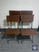 A set of four metal and teak folding garden chairs