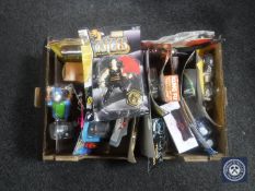 A box containing assorted action figures and toys