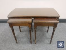 A mahogany glass topped coffee table fitted two beneath