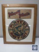 A cardboard "Player's Please" and "Player's Navy Cut" advertisement mounted in a frame