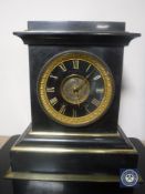 A Victorian black slate and brass mantel clock