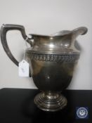 A white metal jug stamped Sterling, height 22.5cm CONDITION REPORT: 717g.