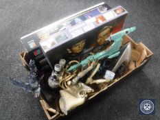 A box containing a collection of assorted Star Trek games and toys,