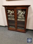 A Victorian and later glazed mahogany bookcase top with 'Fry's Chocolate' advertising,