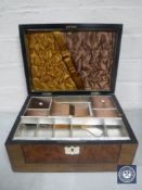 A Victorian walnut workbox, containing some costume jewellery.