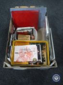 A box of martial arts items including books, magazines,
