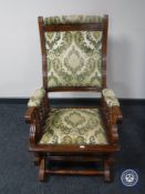 An Edwardian mahogany rocking chair