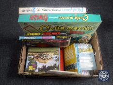 A box containing mid 20th century jigsaws including Thunderbirds and Stingray,