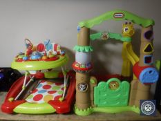 A Little Tykes activity tree house together with a baby walker