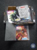 A box containing nine The Classic Marvel Figurine Collection folders with magazines