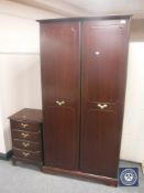 A mahogany double door wardrobe and bedside chest