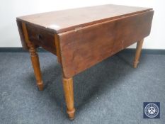 A Victorian pine flap-sided kitchen table fitted a drawer