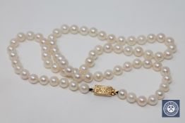 A cultured pearl necklace with 18ct gold clasp
