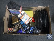 A box containing vintage Scalextric cars,