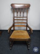 A Victorian mahogany rocking chair