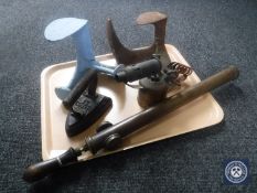 A tray containing two cast iron cobblers lasts, press burner, brass garden sprayer,