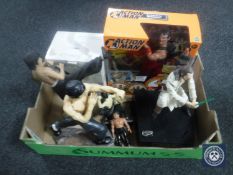 A box containing Star Wars figure on stand, Bruce Lee figures,