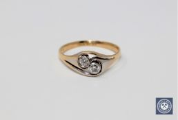 An 18ct gold two-stone diamond ring,