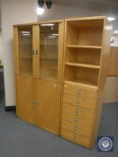 A Swedish beech effect Ulferts modular display cabinet fitted cupboards and drawers beneath