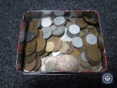 A tin containing pre-decimal British and continental coins