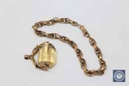 A 9ct gold fancy link bracelet, 8.94g, together with an antique swivel fob.