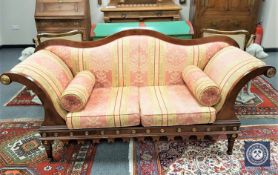 A nineteenth century mahogany scroll arm settee with bolster cushions, width 194 cm.