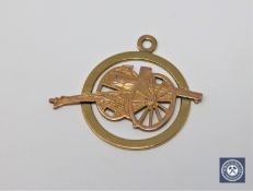 An 18ct gold French artillery pendant