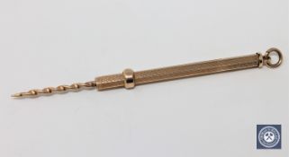 An extendable 9ct gold corkscrew