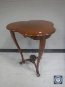 A mahogany shaped top occasional table