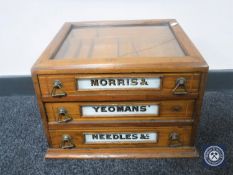 An early 20th century inlaid mahogany table top haberdasher's cabinet,