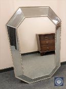 A contemporary bevelled octagonal mirror, 120 cm x 81 cm.
