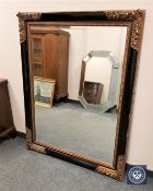 An ebonised and gilt overmantel mirror,