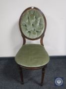 A Victorian bedroom chair in buttoned fabric